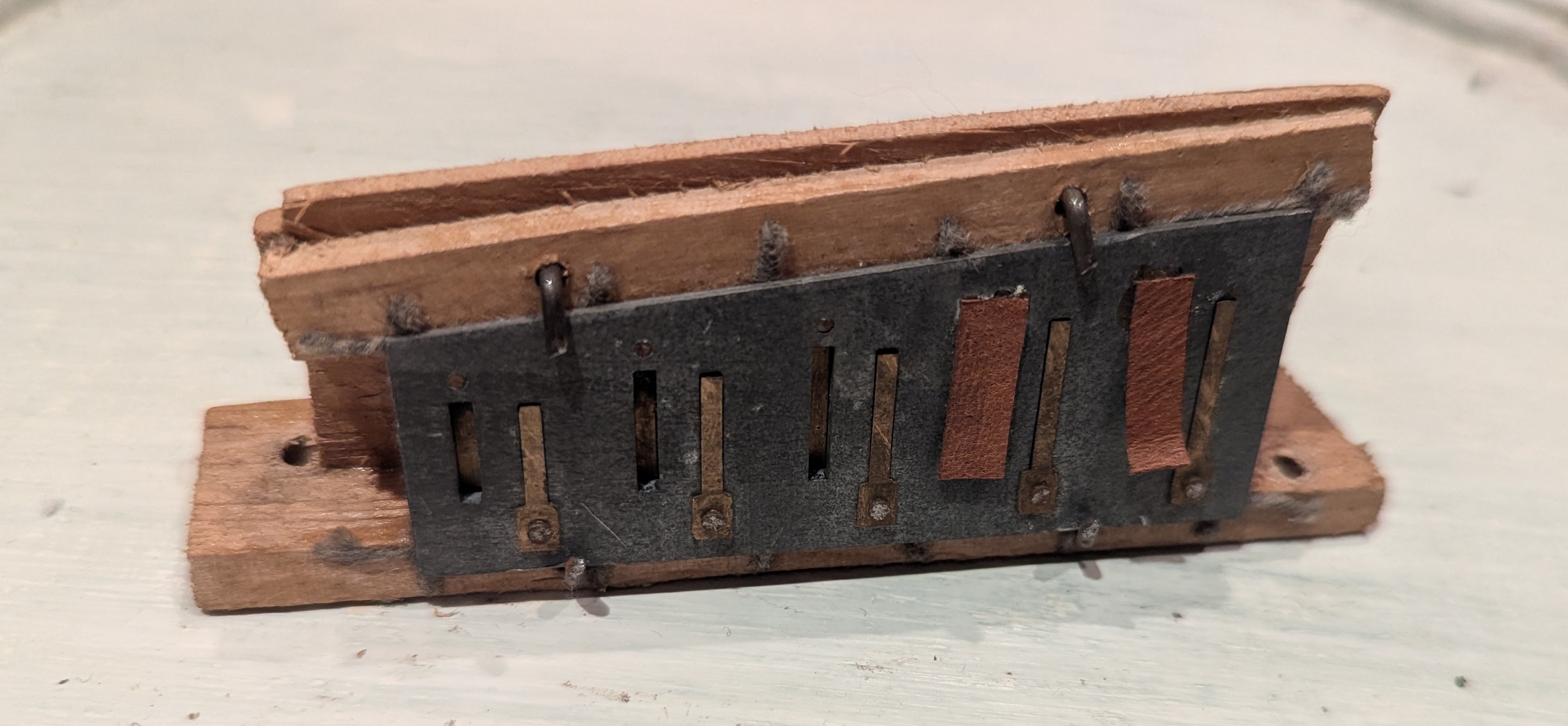 Concertina reed plate.